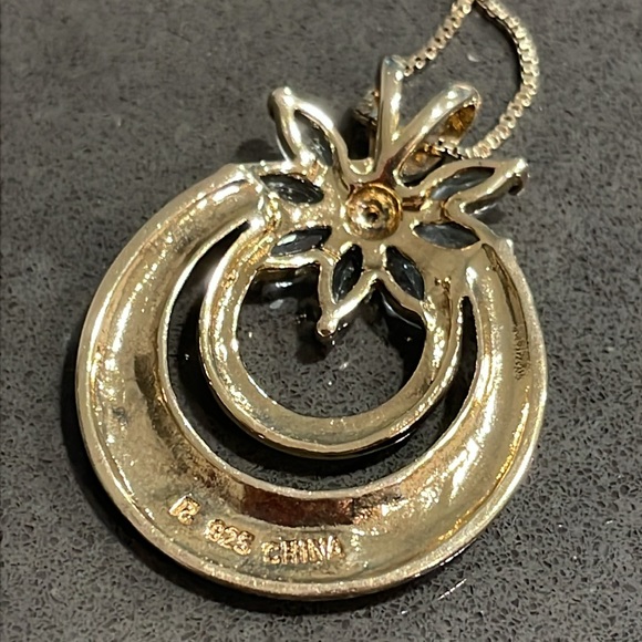 Ross Simons Gold Tone over 925 Silver Blue
Topaz and Cubic Zirconia Necklace - Picture 6 of 12